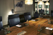 Rickhouse: A boardroom with natural light, leather executive chairs and a 62 inch SmartTV.